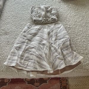 For Love and Lemons off-white mini skirt and strapless top set.